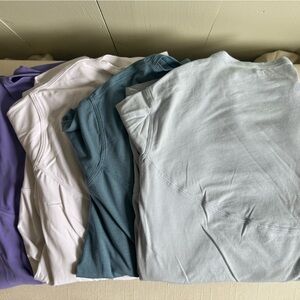 lululemon back in action NuLu Tees in Lavender, White, Teal, Light Blue